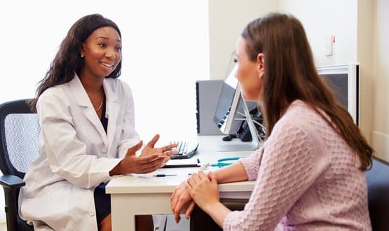 A doctor consults with a patient