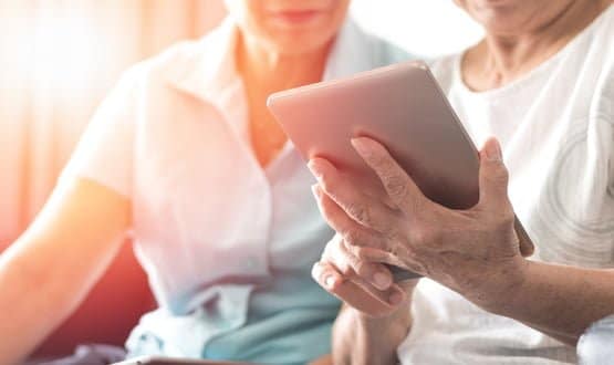 Elderly couple using technology