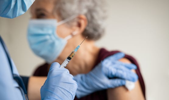 Vaccine being administered